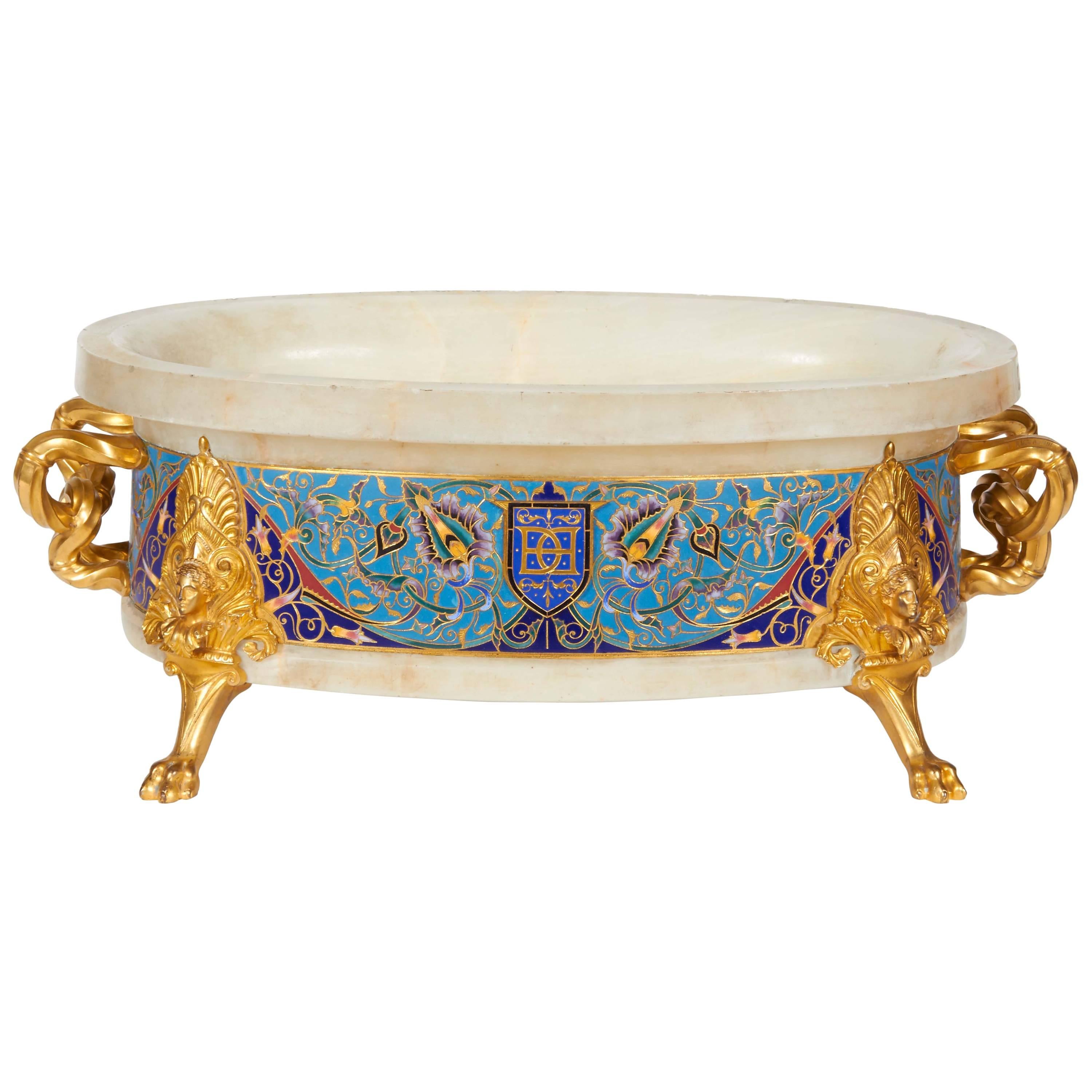 Ferdinand Barbedienne,
French, 1810-1892.
A large Néo-Grec ormolu and cloisonné champleve enamel decorated onyx jardinière centerpiece. Most possibly designed by Louis-Constant Sévin and Edouard Lievre / Lièvre.

One handle signed F.