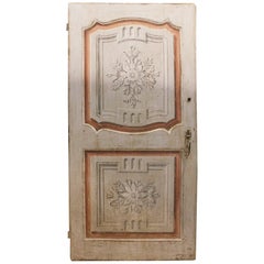 Lacquered wooden door, one leaf with painted panels, Italy