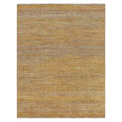 Tapis contemporain à rayures dorées et motifs géométriques de Rug & Kilim