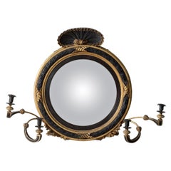 A Regency Giltwood and Ebonised Convex Mirror
