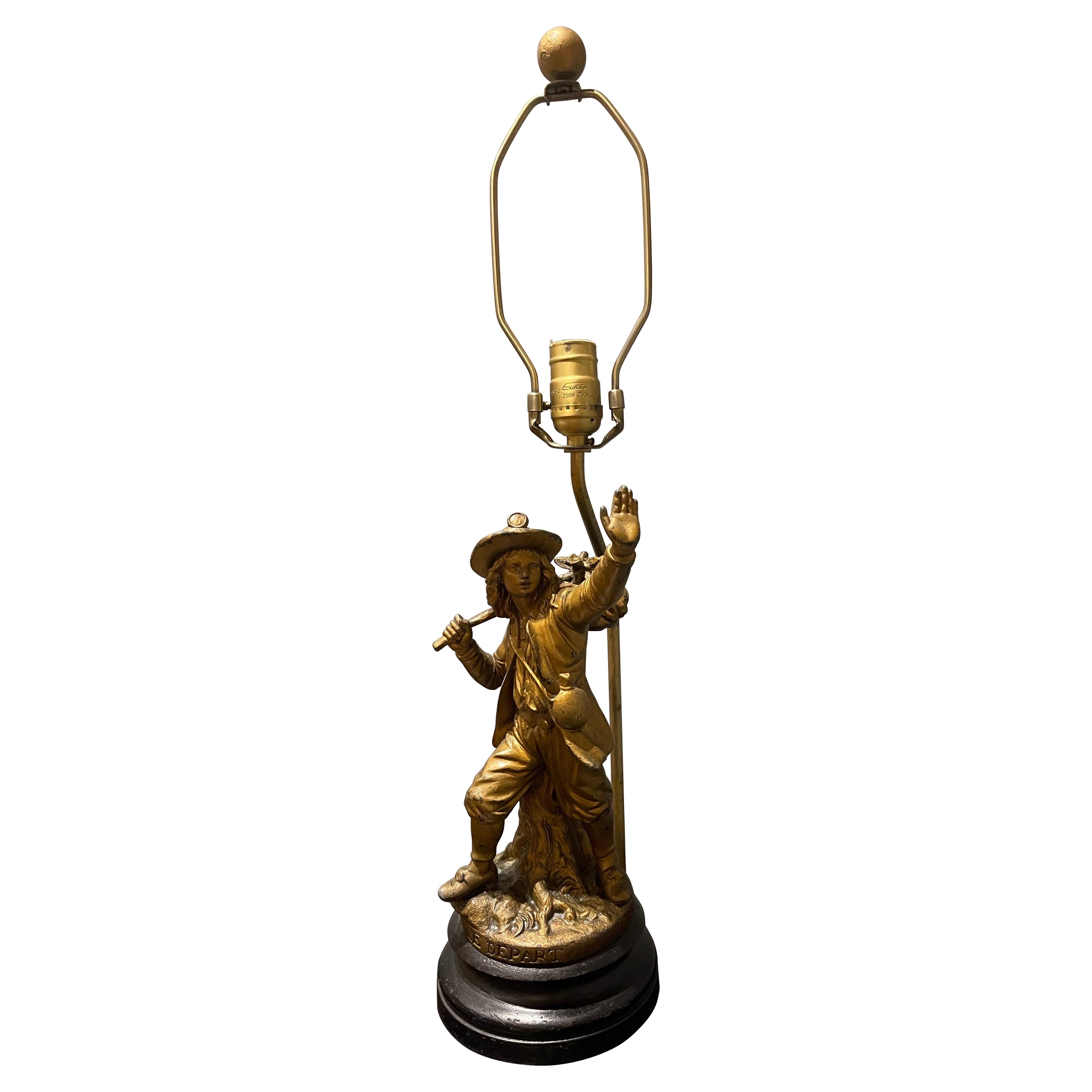 Figura francesa de metal dorado de un hombre partiendo "Le Depart" sobre base, Siglo XIX