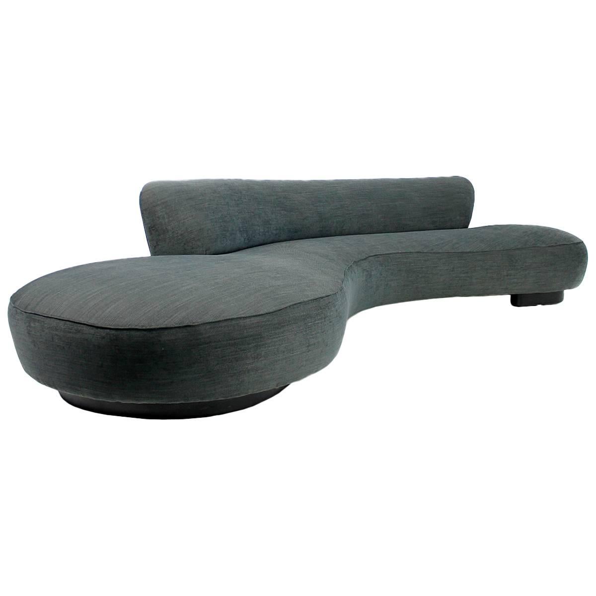 Very large serpentine sofa by Vladimir Kagan for Directional. The sofa is in a very good condition, it was covered in 2014 with high quality smooth woven fabric, of course free standing, upholstery in best condition. The legs were covered with black