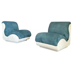 Set of two seventies armchairs, fiberglass structure with blue ribbed fabric
