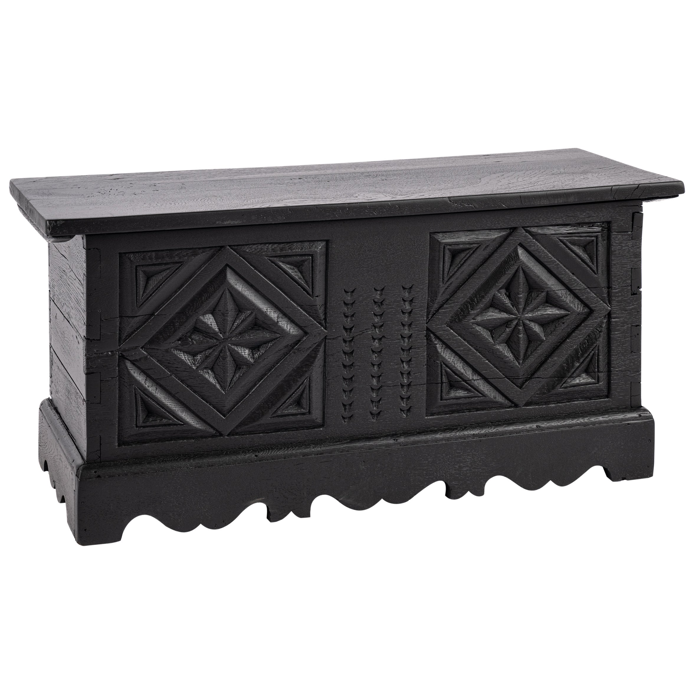 Small Antique German solid blackened oak chest with intricate carvings.