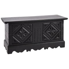 Small Antique German solid blackened oak chest with intricate carvings.