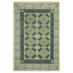 Alfombra Modern Classics de Rug & Kilim en crema, azul y amarillo, con motivos florales