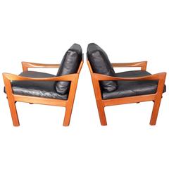 Illum Wikkelsø, a Pair of Teak and Leather Lounge Chairs