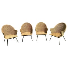 Ensemble de quatre chaises longues vintage en osier et en fer