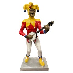 Polychrome Bronze eines Jesters aus dem St. Croix-St. Croix, der ein Banjo spielt