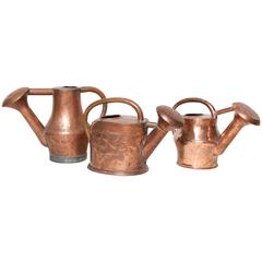 Three Copper Watering Cans