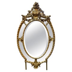 Antique 19th Century Large Scale French Oval Carved and Giltwood Mirror