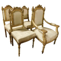 juego de salón con 1 sillón y 3 sillas talladas y doradas, Italia