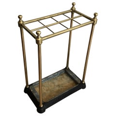 Paragüero rectangular de latón y hierro fundido. Obra francesa. Alrededor de 1900