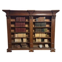 Bookcase in solid poplar wood with carved columns and cherubs, Italy