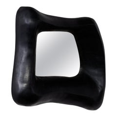 Small brutalist sculptural black ebonised mirror by Christophe Daguet