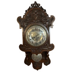 Wall clock in carved wood, Germany, 19th century.