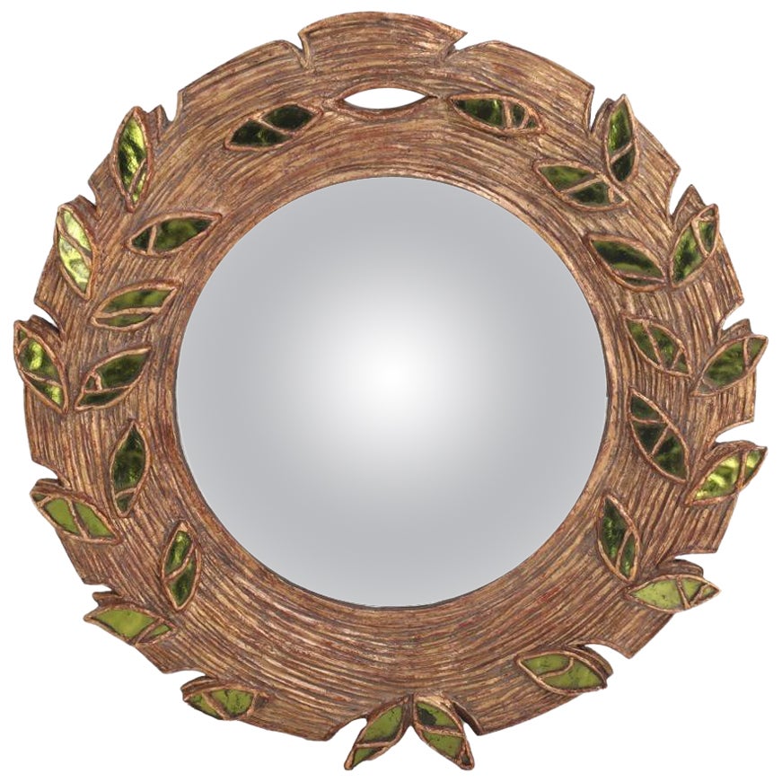 Green glass and resin convex mirror.