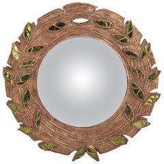 Green glass and resin convex mirror.