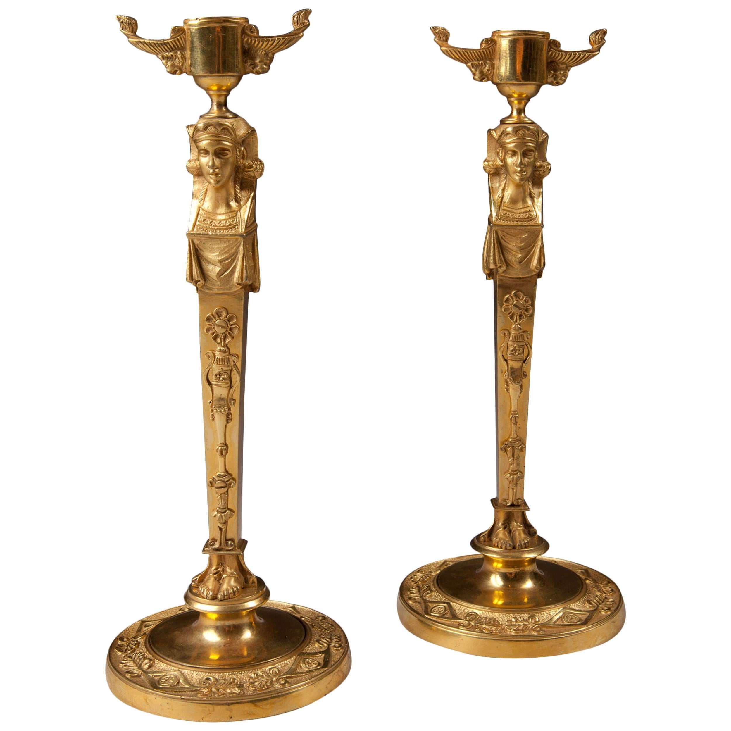 Pair of Neo Egyptian Candlesticks in Gilt Ormolu For Sale