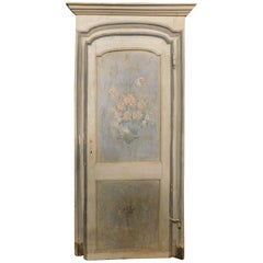 Antique lacquered and painted arched door with frame, Italy