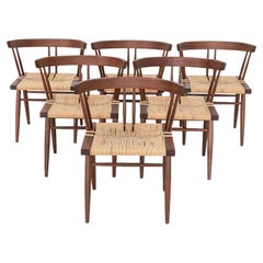 2014 Ensemble de six chaises de salle à manger en noyer noir Mira Nakashima à assise en herbe.