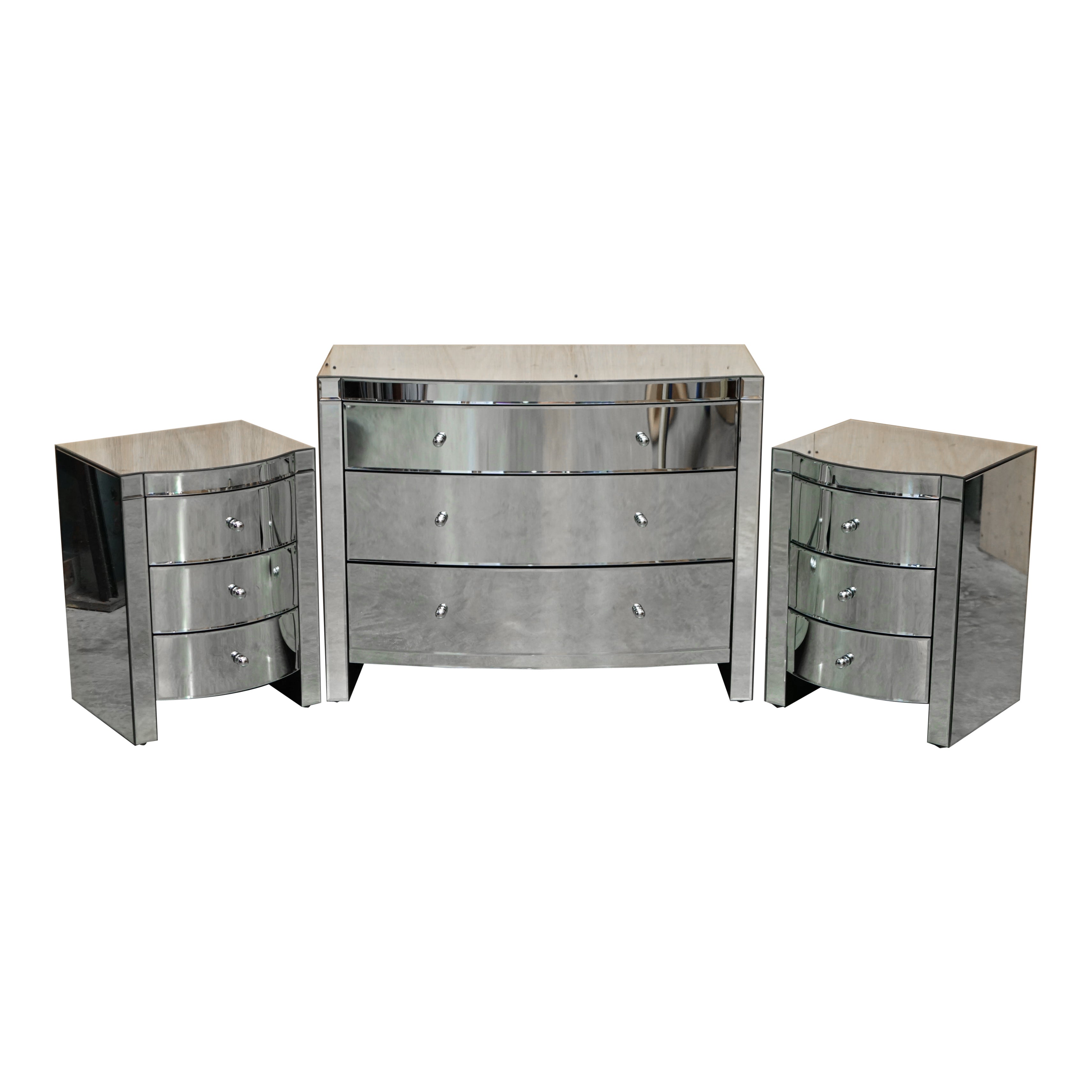 SUITE OF BOW FRONTED MIRRORED GLASS CHEST OF DRAWERS WiTH PAIR OF SIDE TABLES