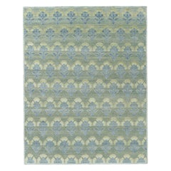 Rug & Kilim: design personalizzato di un tappeto a blocchi con motivi floreali blu e verdi