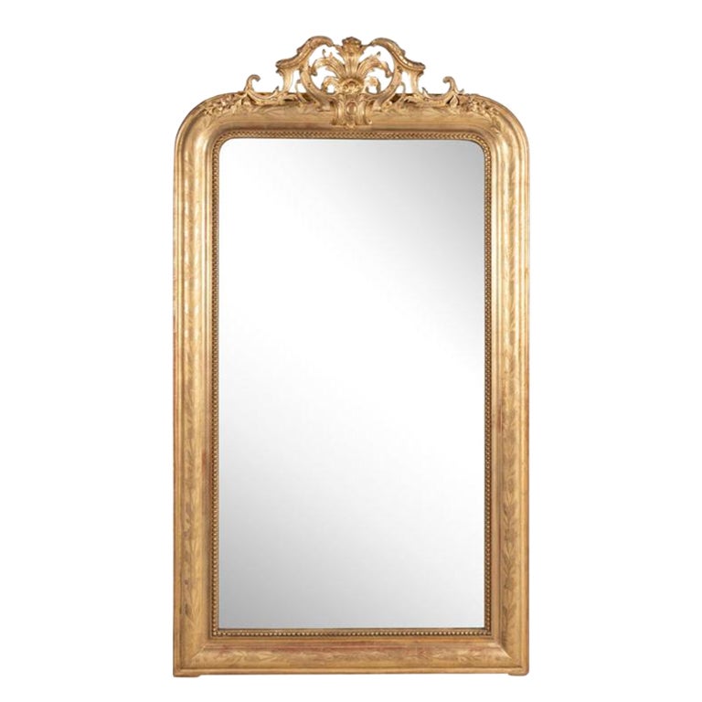 Elegant 19th-century French gilded wood mirror with floral motifs