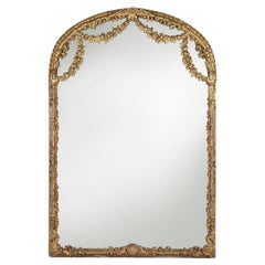 Large baroque decorated chimney mirror in gilted wood, France ca. 1800
