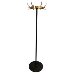 Perchero de latón y metal lacado en negro de Jacques Adnet