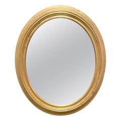 Specchio ovale in legno dorato