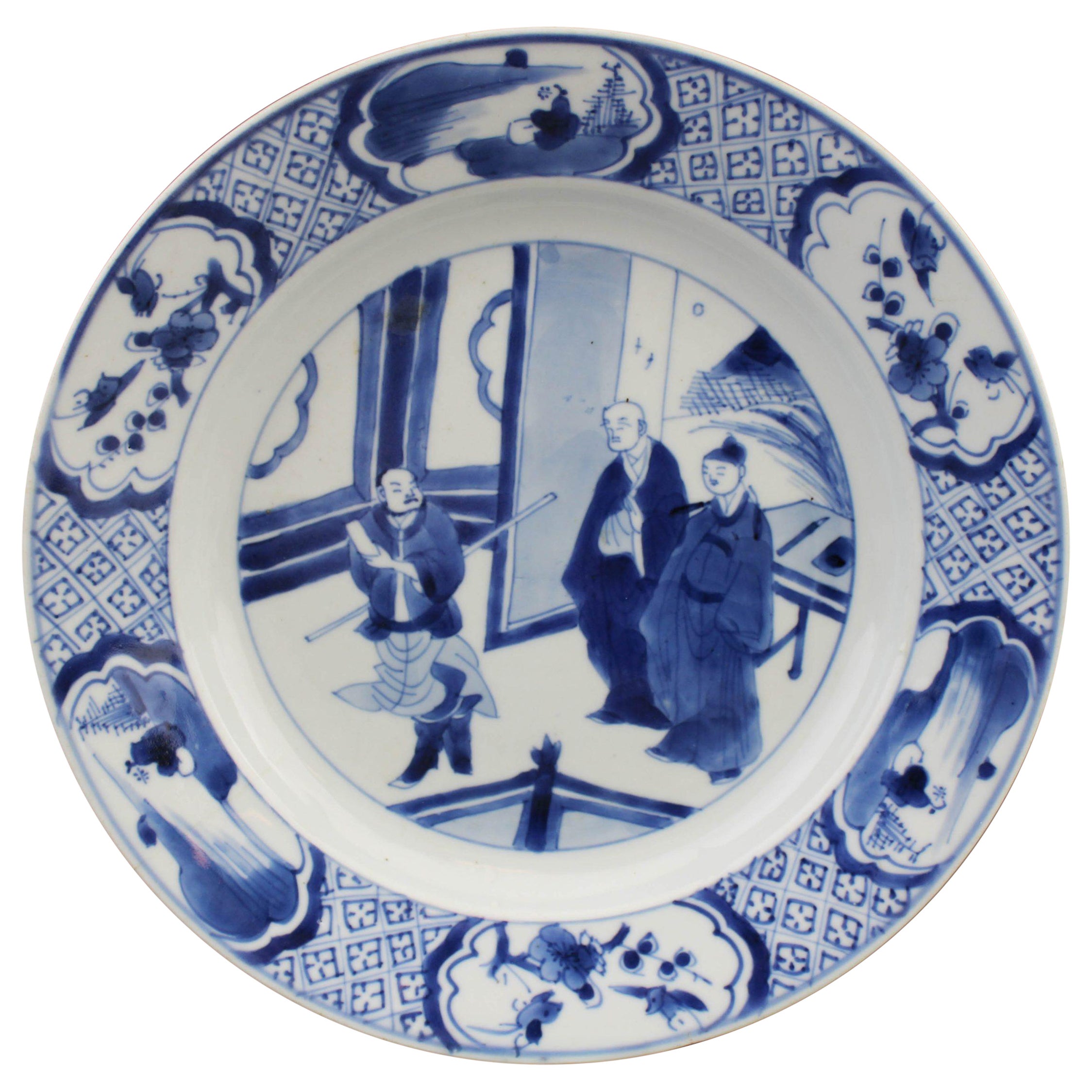 Piatto in porcellana cinese del periodo Kangxi con pagoda figurata e paesaggio in blu e bianco