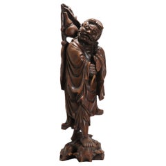 Belle statue chinoise en bois sculpté représentant une femme avec un parasol, 1900