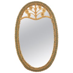 Grand miroir ovale en rotin tressé avec détails filigranes