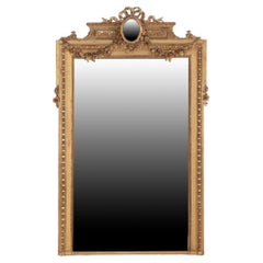 A monumental French Louis XVI style ornate giltwood mirror, C. 1890.