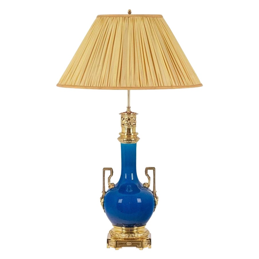 Lamp with blue porcelain and gilded bronze handles. Circa 1880.