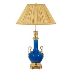 Lamp with blue porcelain and gilded bronze handles. Circa 1880.