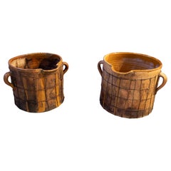 Antique Pair of Enameled Ceramic Milk Churns with Handles & Iron Netting Covering Them