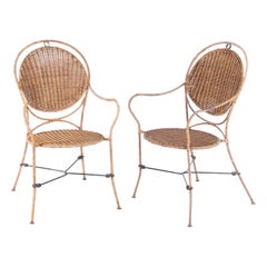 Pair of rattan and iron armchairs