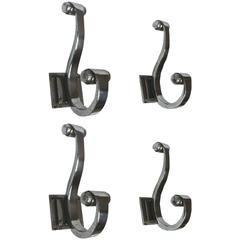 Rare, Superb Quality Set of Four Metal Coat Hangers in the Style of Ruhlmann 9