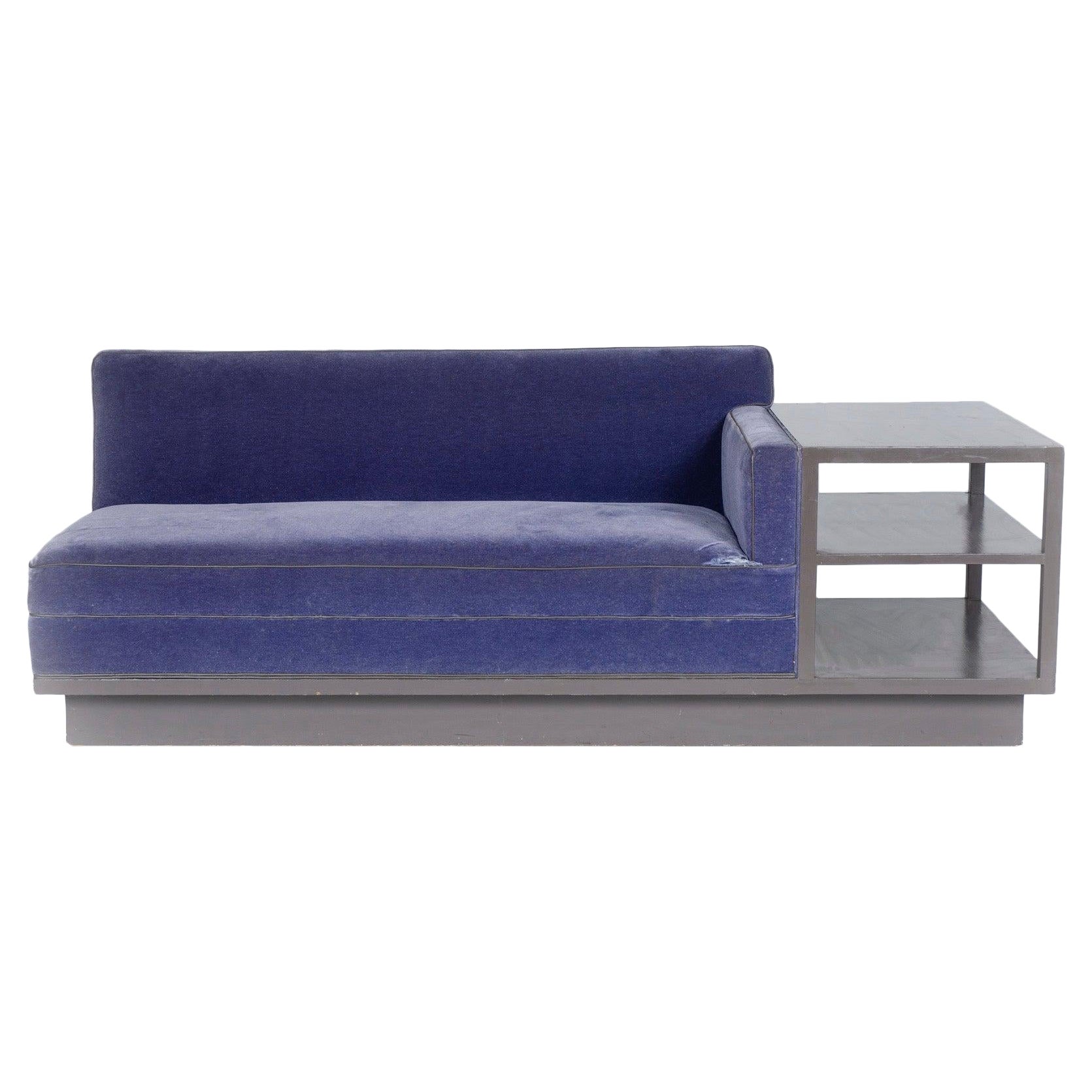 Sofa with attached side table on casters For Sale