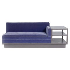 Sofa with attached side table on casters