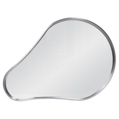 Miroir mural en acier biomorphique