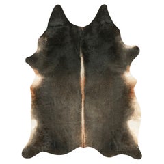 Rug & Kilim’s Large Cowhide Rug in Black and Brown Tones