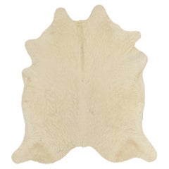 Rug & Kilim’s Large Cowhide Rug in Cream Tones