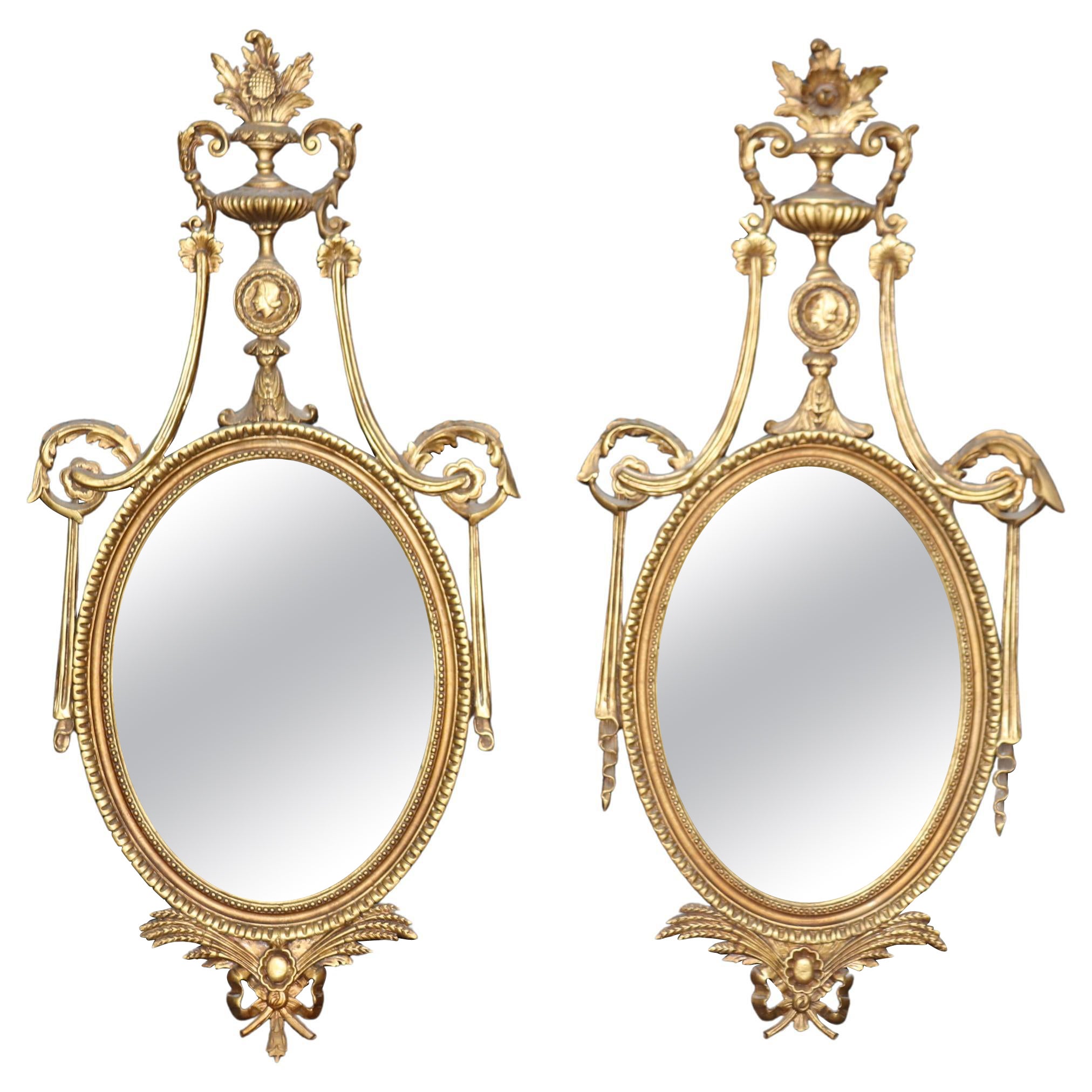 Unique Husband and Wife Pair of Gilded Carved Louis XVI Style Mirrors