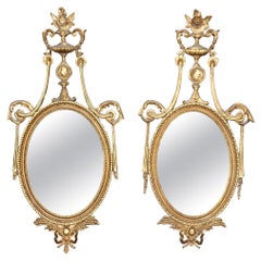 Unique Husband and Wife Pair of Gilded Carved Louis XVI Style Mirrors