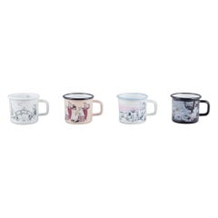 Muurla, Finland. Four enamel mugs with motifs from the Moomintroll stories