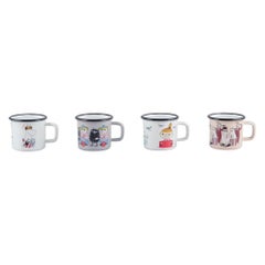Muurla, Finland. Four enamel mugs with motifs from the Moomintroll stories