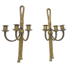 Paire d'appliques murales à bougies de style Louis XVI du XIXe siècle, ornées de nœuds et de glands